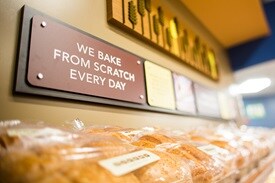 Close up of the "we bake from scratch every day" sign in the bakery