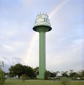 Publix birthday cake water tower rainbow behind