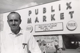 Mr. George in front of Publix store black and white