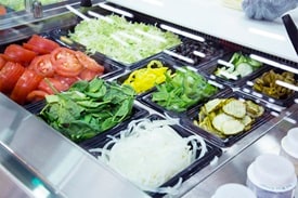 Close up of veggies used for subs