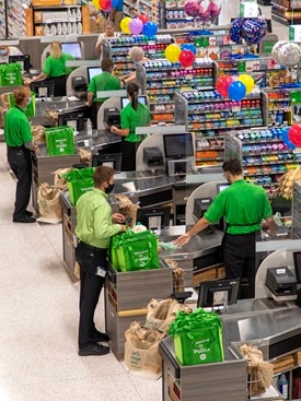Cashiers working at registers 
