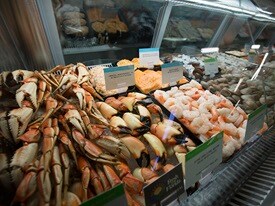 Publix seafood case stocked with crab and shrimp