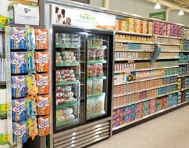 Publix pet food aisle with refrigerator case on left