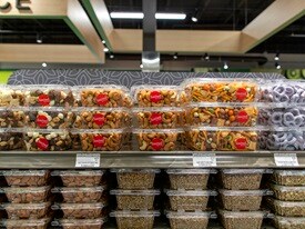 Packaged dried fruits, nuts and covered pretzels in the produce department