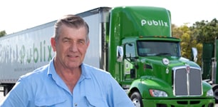 truck driver in front of Publix truck